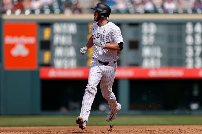 Sep 15, 2024; Denver, Colorado, USA; Colorado Rockies catcher Jacob Stallings (25) rounds the bases on a solo home run in the third inning against the Chicago Cubs at Coors Field. Mandatory Credit: Isaiah J. Downing-Imagn Images