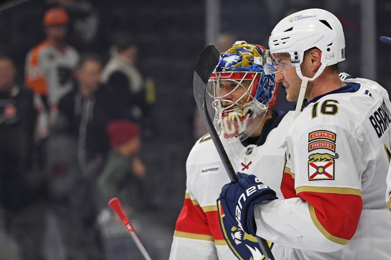 Dec 5, 2024; Philadelphia, Pennsylvania, USA; Florida Panthers goaltender Spencer Knight (30) and Florida Panthers center Aleksander Barkov (16) celebrate win against the Philadelphia Flyers at Wells Fargo Center. Mandatory Credit: Eric Hartline-Imagn Images