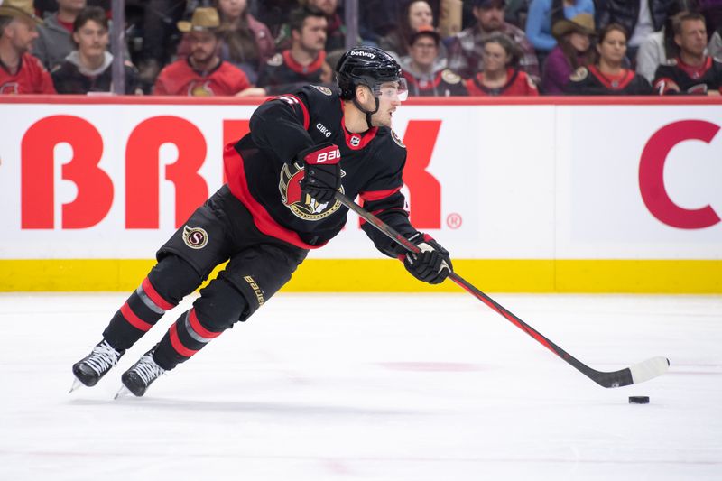 Mar 1, 2024; Ottawa, Ontario, CAN; Ottawa Senators defenseman Erik Brannstrom (26) skates with the puck in the second period against the Arizona Coyotes at the Canadian Tire Centre. Mandatory Credit: Marc DesRosiers-USA TODAY Sports