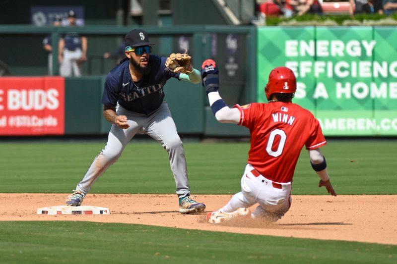 Sep 8, 2024; St. Louis, Missouri, USA; St. Louis Cardinals shortstop Masyn Winn (0) is out at second as Seattle Mariners shortstop J.P. Crawford (3) completes a double-play against designated hitter Alec Burleson (not pictured) during the seventh inning at Busch Stadium. Mandatory Credit: Jeff Le-Imagn Images