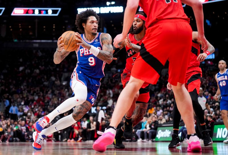 TORONTO, ON - MARCH 31: Kelly Oubre Jr. #9 of the Philadelphia 76ers dribbles against Gary Trent Jr. #33 of the Toronto Raptors during the first half of their basketball game at the Scotiabank Arena on March 31, 2024 in Toronto, Ontario, Canada. NOTE TO USER: User expressly acknowledges and agrees that, by downloading and/or using this Photograph, user is consenting to the terms and conditions of the Getty Images License Agreement. (Photo by Mark Blinch/Getty Images)