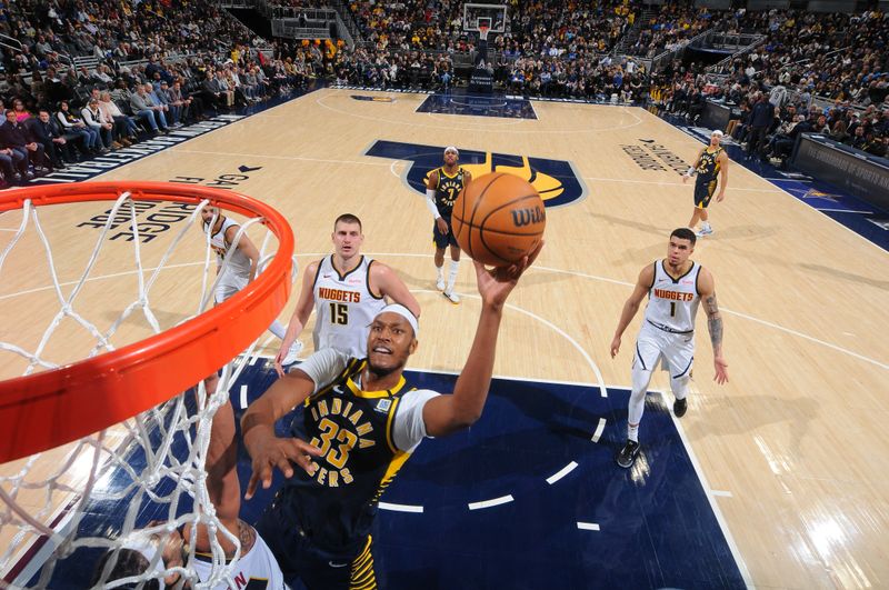 INDIANAPOLIS, IN - JANUARY 23: Myles Turner #33 of the Indiana Pacers shoots the ball during the game against the Denver Nuggets on January 23, 2024 at Gainbridge Fieldhouse in Indianapolis, Indiana. NOTE TO USER: User expressly acknowledges and agrees that, by downloading and or using this Photograph, user is consenting to the terms and conditions of the Getty Images License Agreement. Mandatory Copyright Notice: Copyright 2024 NBAE (Photo by Ron Hoskins/NBAE via Getty Images)