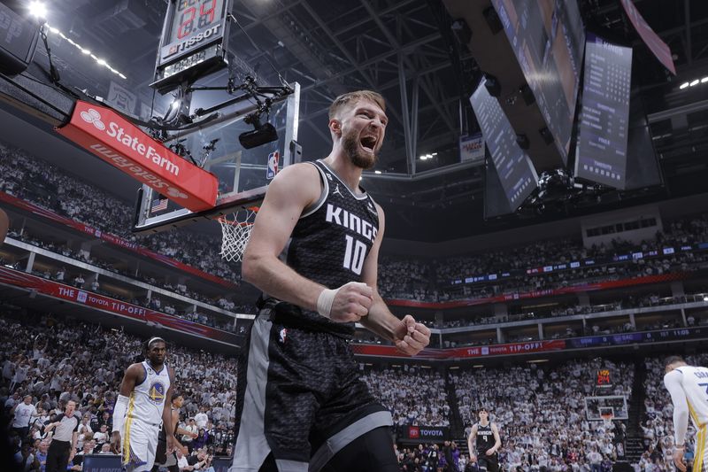 SACRAMENTO, CA - APRIL 15: Domantas Sabonis #10 of the Sacramento Kings celebrates a play during Round 1 Game 1 of the 2023 NBA Playoffs against the Golden State Warriors on April 15, 2023 at Golden 1 Center in Sacramento, California. NOTE TO USER: User expressly acknowledges and agrees that, by downloading and or using this Photograph, user is consenting to the terms and conditions of the Getty Images License Agreement. Mandatory Copyright Notice: Copyright 2023 NBAE (Photo by Rocky Widner/NBAE via Getty Images)