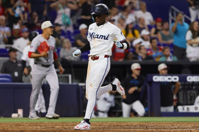 Jul 4, 2024; Miami, Florida, USA; Miami Marlins pinch hitter Nick Gordon (1) scores against the Boston Red Sox during the eighth inning at loanDepot Park. Mandatory Credit: Sam Navarro-USA TODAY Sports