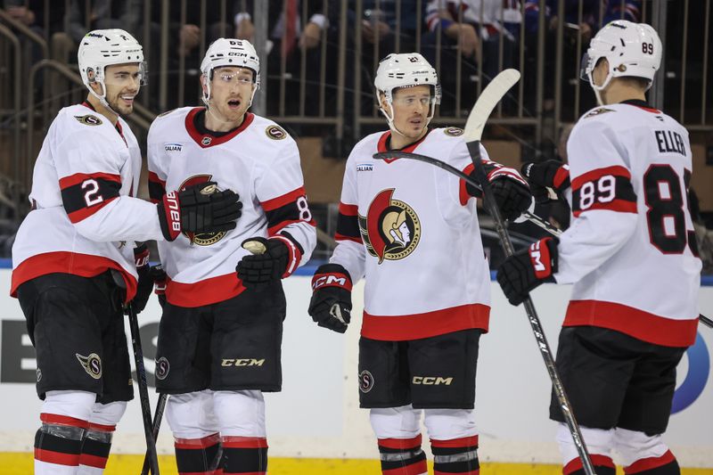 Jan 14, 2026; New York, New York, USA;  Ottawa Senators defenseman Jake Sanderson (85) celebrates with his teammates after scoring a goal in the second period against the New York Rangers at Madison Square Garden. Mandatory Credit: Wendell Cruz-Imagn Images