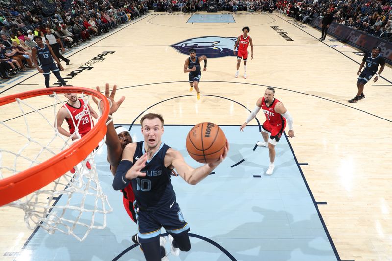 MEMPHIS, TN - FEBRUARY 14: Luke Kennard #10 of the Memphis Grizzlies drives to the basket during the game against the Houston Rockets on February 14, 2024 at FedExForum in Memphis, Tennessee. NOTE TO USER: User expressly acknowledges and agrees that, by downloading and or using this photograph, User is consenting to the terms and conditions of the Getty Images License Agreement. Mandatory Copyright Notice: Copyright 2024 NBAE (Photo by Joe Murphy/NBAE via Getty Images)