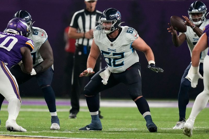 Tennessee Titans center Corey Levin (62) looks to block during the second half of an NFL football game against the Minnesota Vikings, Saturday, Aug. 19, 2023, in Minneapolis. (AP Photo/Charlie Neibergall)