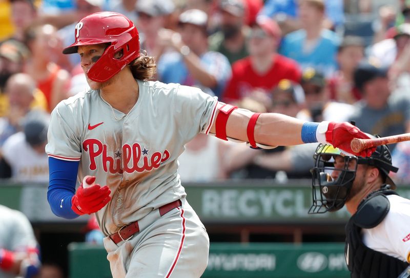 Jul 21, 2024; Pittsburgh, Pennsylvania, USA;  Philadelphia Phillies third baseman Alec Bohm (28) hits an RBI single against the Pittsburgh Pirates during the seventh inning at PNC Park. The Phillies won 6-0. Mandatory Credit: Charles LeClaire-USA TODAY Sports