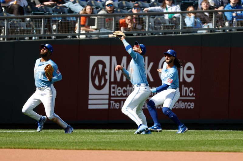 Apr 6, 2025; Kansas City, Missouri, USA; Kansas City Royals third base Maikel Garcia (11) Kansas City Royals shortstop Bobby Witt Jr. (7) and Kansas City Royals second base Jonathan India (6) merge on a pop fly at Kauffman Stadium. Mandatory Credit: Gary Rohman-Imagn Images