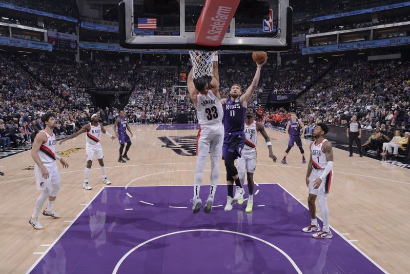 SACRAMENTO, CA - OCTOBER 28: Domantas Sabonis #11 of the Sacramento Kings drives to the basket during the game against the Portland Trail Blazers on October 28, 2024 at Golden 1 Center in Sacramento, California. NOTE TO USER: User expressly acknowledges and agrees that, by downloading and or using this Photograph, user is consenting to the terms and conditions of the Getty Images License Agreement. Mandatory Copyright Notice: Copyright 2024 NBAE (Photo by Rocky Widner/NBAE via Getty Images)