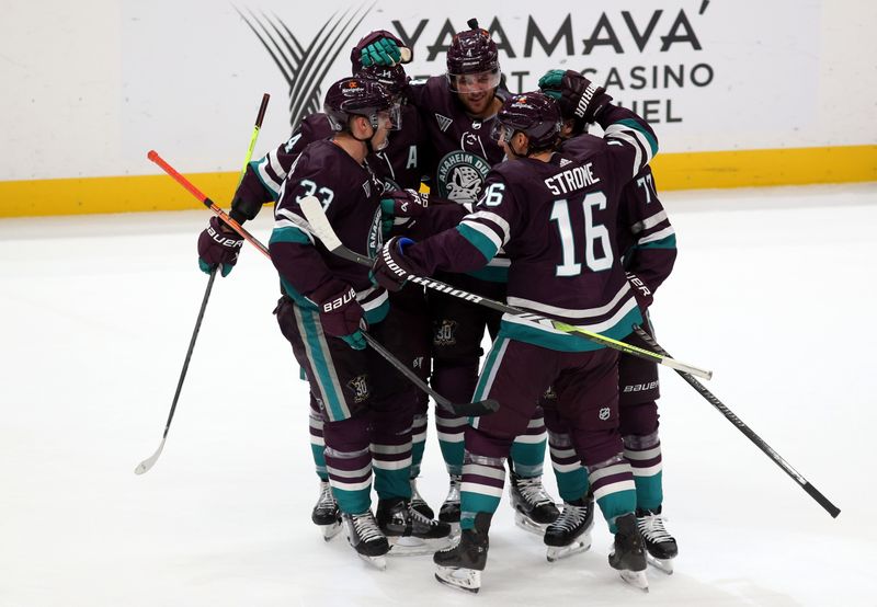 Nov 12, 2023; Anaheim, California, USA; Anaheim Ducks right wing Frank Vatrano (77) celebrates with teammates after scoring during the first period against the San Jose Sharks at Honda Center. Mandatory Credit: Jason Parkhurst-USA TODAY Sports