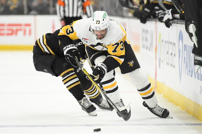 Jan 4, 2024; Boston, Massachusetts, USA; Pittsburgh Penguins defenseman Pierre-Olivier Joseph (73) skates with the puck during the second period against the Boston Bruins at TD Garden. Mandatory Credit: Bob DeChiara-USA TODAY Sports