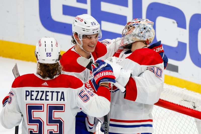 Mar 24, 2024; Seattle, Washington, USA; Montreal Canadiens left wing Juraj Slafkovsky (20) celebrates with goaltender Cayden Primeau (30) following a 5-1 victory against the Seattle Kraken at Climate Pledge Arena. Mandatory Credit: Joe Nicholson-USA TODAY Sports