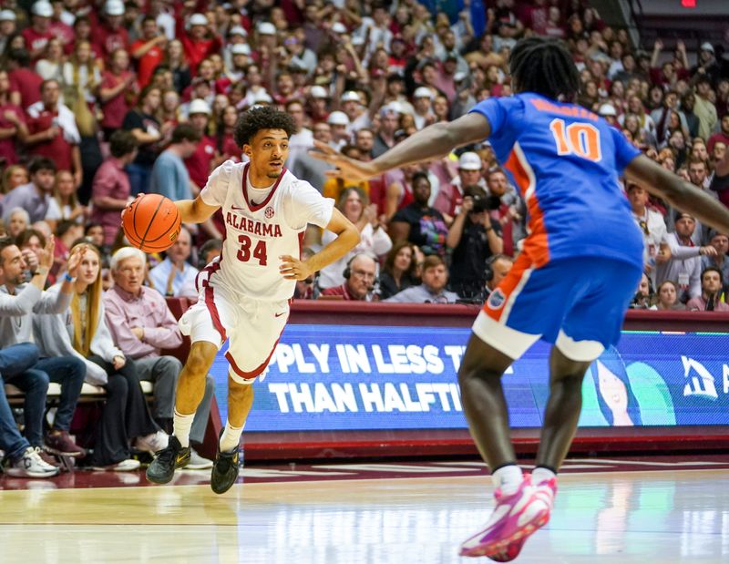 Feb 8, 2023; Tuscaloosa, Alabama, USA; Alabama Crimson Tide guard Jaden Quinerly (34) controls the ball against the Florida Gators during the second half at Coleman Coliseum. Mandatory Credit: Marvin Gentry-USA TODAY Sports