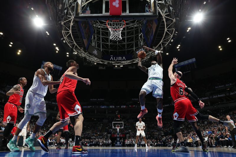 MINNEAPOLIS, MN -  MARCH 31: Anthony Edwards #5 of the Minnesota Timberwolves drives to the basket during the game against the Chicago Bulls on March 31, 2024 at Target Center in Minneapolis, Minnesota. NOTE TO USER: User expressly acknowledges and agrees that, by downloading and or using this Photograph, user is consenting to the terms and conditions of the Getty Images License Agreement. Mandatory Copyright Notice: Copyright 2024 NBAE (Photo by David Sherman/NBAE via Getty Images)