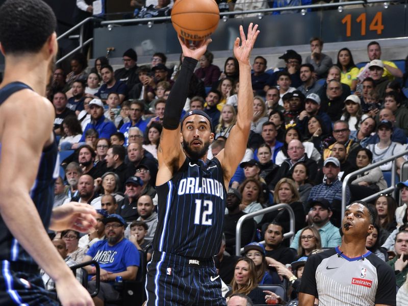 ORLANDO, FL - JANUARY 5 :  Trevelin Queen #12 of the Orlando Magic shoots the ball during the game against the Utah Jazz on January 5, 2025 at Kia Center in Orlando, Florida. NOTE TO USER: User expressly acknowledges and agrees that, by downloading and or using this photograph, User is consenting to the terms and conditions of the Getty Images License Agreement. Mandatory Copyright Notice: Copyright 2025 NBAE (Photo by Gary Bassing/NBAE via Getty Images)