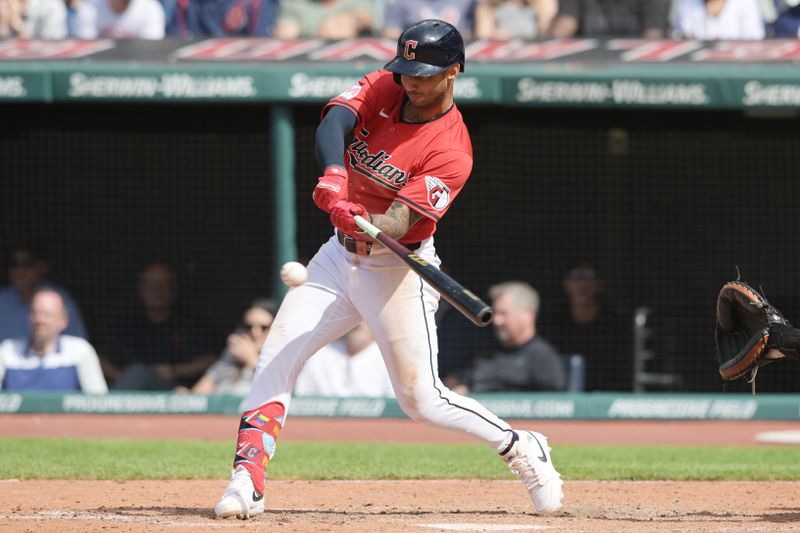 May 8, 2024; Cleveland, Ohio, USA; Cleveland Guardians shortstop Brayan Rocchio (4) hits a game winning RBI single during the tenth inning Detroit Tigers at Progressive Field. Mandatory Credit: Ken Blaze-USA TODAY Sports