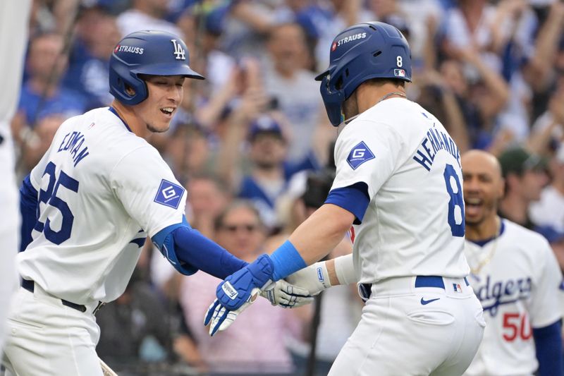 Oct 11, 2024; Los Angeles, California, USA; Los Angeles Dodgers third baseman Enrique Hernandez (8) celebrates with outfielder Tommy Edman (25) after hitting a solo home run in the second inning against the San Diego Padres during game five of the NLDS for the 2024 MLB Playoffs at Dodger Stadium. Mandatory Credit: Jayne Kamin-Oncea-Imagn Images