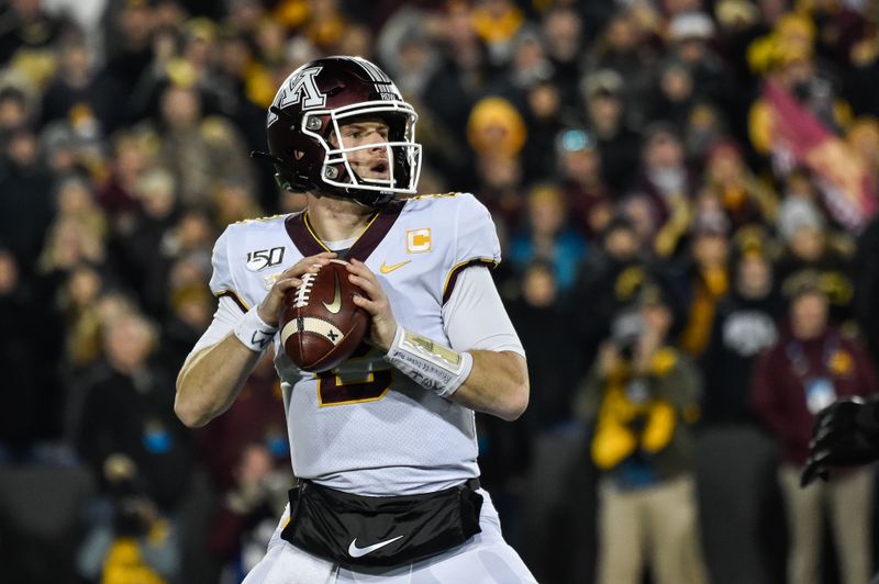 Nov 16, 2019; Iowa City, IA, USA; Minnesota Golden Gophers quarterback Tanner Morgan (2) drops back to throw a pass against the Iowa Hawkeyes during the fourth quarter at Kinnick Stadium. Mandatory Credit: Jeffrey Becker-USA TODAY Sports