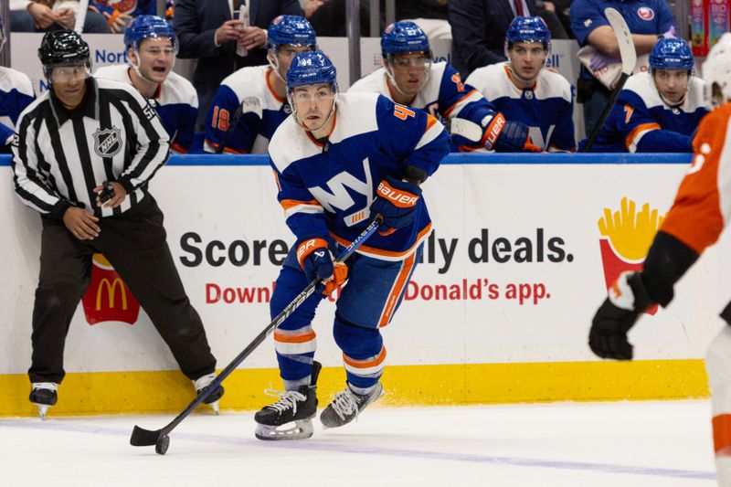 Nov 25, 2023; Elmont, New York, USA; New York Islanders center Jean-Gabriel Pageau (44) skates with the puck against the Philadelphia Flyers during overtime at UBS Arena. Mandatory Credit: Thomas Salus-USA TODAY Sports