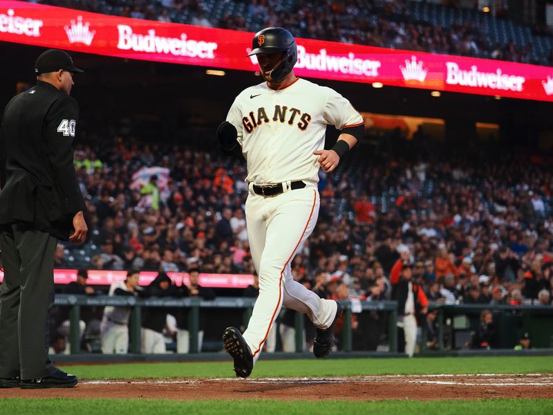 Aug 28, 2023; San Francisco, California, USA; San Francisco Giants first baseman J.D. Davis (7) scores a run against the Cincinnati Reds during the third inning at Oracle Park. Mandatory Credit: Kelley L Cox-USA TODAY Sports