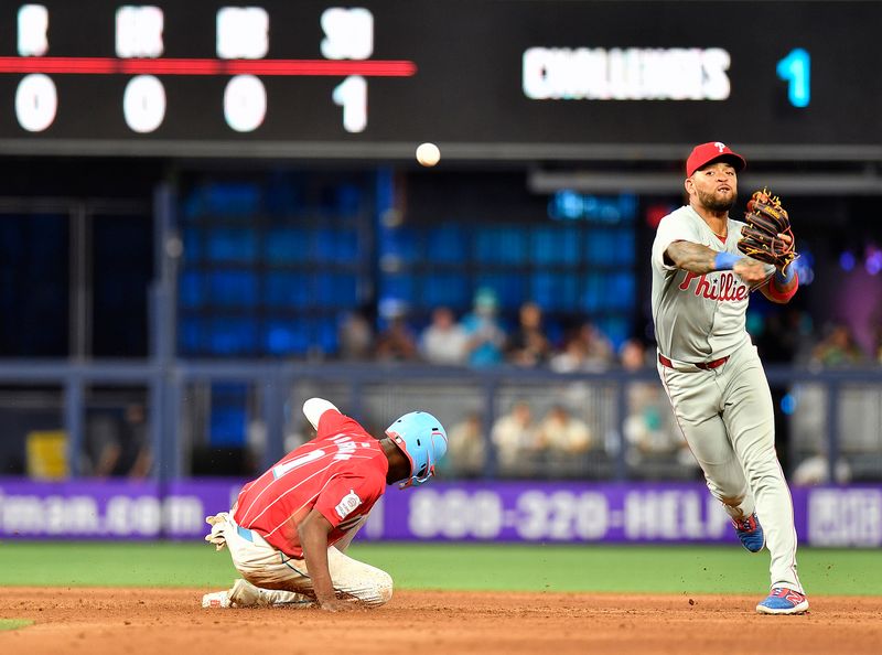 May 11, 2024; Miami, Florida, USA;  Philadelphia Phillies shortstop Edmundo Sosa (33) throws to first base after forcing out Miami Marlins outfielder Nick Gordon (1) during the ninth inning at loanDepot Park. Mandatory Credit: Michael Laughlin-USA TODAY Sports