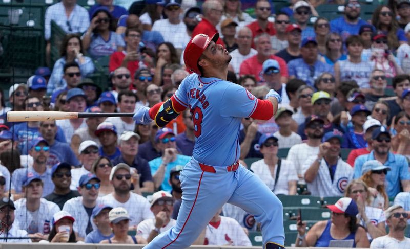 Aug 3, 2024; Chicago, Illinois, USA; St. Louis Cardinals third baseman Nolan Arenado (28) hits a two-run single against the Chicago Cubs during the eighth inning at Wrigley Field. Mandatory Credit: David Banks-USA TODAY Sports