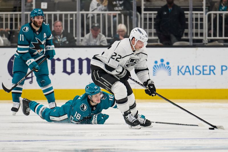 Apr 4, 2024; San Jose, California, USA; San Jose Sharks center Jack Studnicka (16) extends for the puck against Los Angeles Kings left wing Kevin Fiala (22) during the second period at SAP Center at San Jose. Mandatory Credit: Robert Edwards-USA TODAY Sports