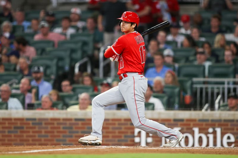 Aug 1, 2023; Atlanta, Georgia, USA; Los Angeles Angels designated hitter Shohei Ohtani (17) hits a single against the Atlanta Braves in the sixth inning at Truist Park. Mandatory Credit: Brett Davis-USA TODAY Sports