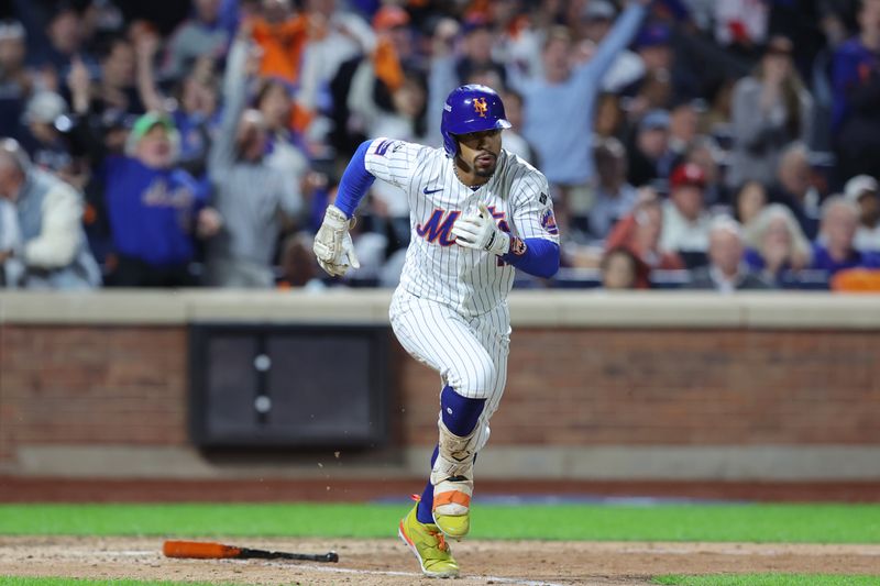 Oct 8, 2024; New York City, New York, USA; New York Mets shortstop Francisco Lindor (12) runs after hitting an RBI double against the Philadelphia Phillies in the eighth inning during game three of the NLDS for the 2024 MLB Playoffs at Citi Field. Mandatory Credit: Brad Penner-Imagn Images