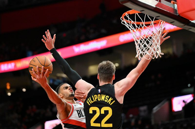 PORTLAND, OREGON - OCTOBER 18: Rayan Rupert #21 of the Portland Trail Blazers shoots the ball against Kyle Filipowski #22 of the Utah Jazz during the fourth quarter of the preseason game at Moda Center on October 18, 2024 in Portland, Oregon. NOTE TO USER: User expressly acknowledges and agrees that, by downloading and or using this photograph, User is consenting to the terms and conditions of the Getty Images License Agreement. (Photo by Alika Jenner/Getty Images)