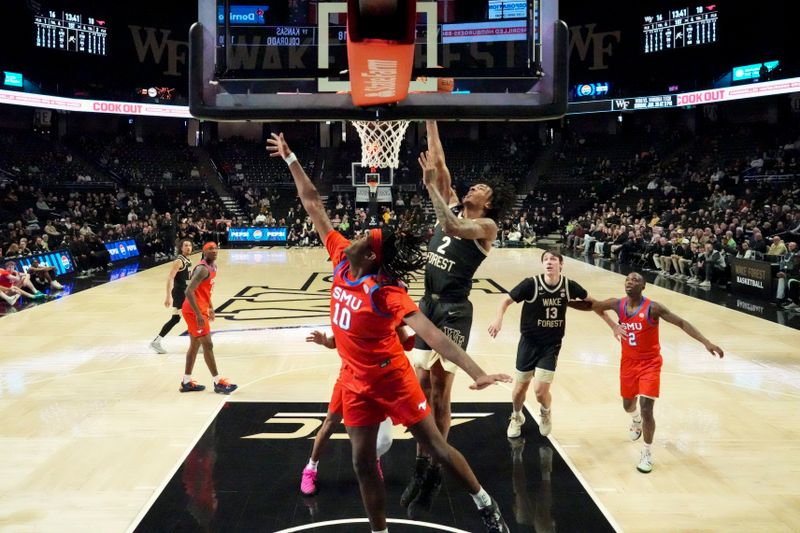 Jan 20, 2026; Winston-Salem, North Carolina, USA; Wake Forest Demon Deacons forward Juke Harris (2) makes a lay up defended by Southern Methodist University Mustangs center Jaden Toombs (10) during the game at Lawrence Joel Veterans Memorial Coliseum. Mandatory Credit: Jim Dedmon-Imagn Images