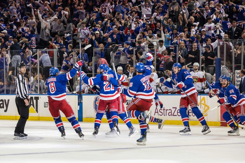 May 24, 2024; New York, New York, USA; New York Rangers center Barclay Goodrow (21) celebrates his game-winning overtime goal with teammates in game two of the Eastern Conference Final of the 2024 Stanley Cup Playoffs against the Florida Panthers at Madison Square Garden. Mandatory Credit: Vincent Carchietta-USA TODAY Sports