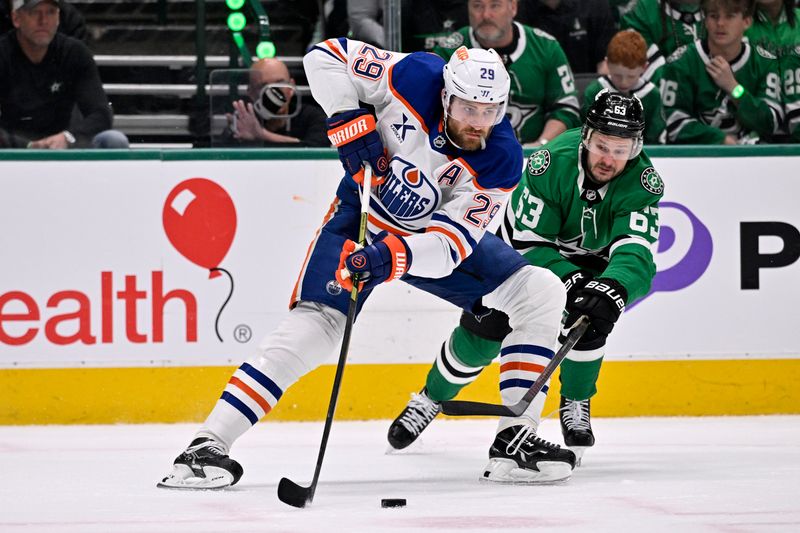 May 21, 2025; Dallas, Texas, USA; Edmonton Oilers center Leon Draisaitl (29) skates with the puck against Dallas Stars right wing Evgenii Dadonov (63) in the first period during game one of the Western Conference Final of the 2025 Stanley Cup Playoffs at American Airlines Center. Mandatory Credit: Jerome Miron-Imagn Images