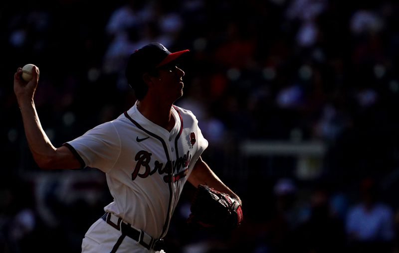 May 27, 2024; Cumberland, Georgia, USA; Atlanta Braves pitcher Jimmy Herget (64) fires off a pitch against the Washington Nationals during the eighth inning at Truist Park. Mandatory Credit: John David Mercer-USA TODAY Sports