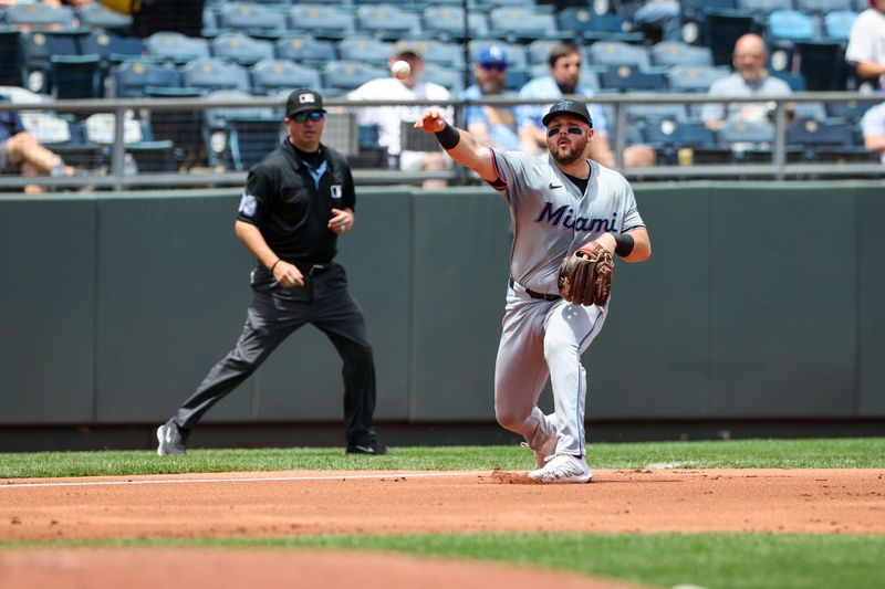 Jun 26, 2024; Kansas City, Missouri, USA; Miami Marlins third baseman Jake Burger (36) throws to first base against the Kansas City Royals during the second inning at Kauffman Stadium. Mandatory Credit: William Purnell-USA TODAY Sports