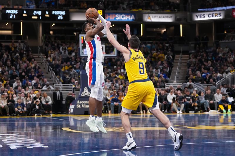 INDIANAPOLIS, INDIANA - NOVEMBER 29: Malik Beasley #5 of the Detroit Pistons attempts a shot while being guarded by T.J. McConnell #9 of the Indiana Pacers in the first quarter of the Emirates NBA Cup game at Gainbridge Fieldhouse on November 29, 2024 in Indianapolis, Indiana. NOTE TO USER: User expressly acknowledges and agrees that, by downloading and or using this photograph, User is consenting to the terms and conditions of the Getty Images License Agreement. (Photo by Dylan Buell/Getty Images)