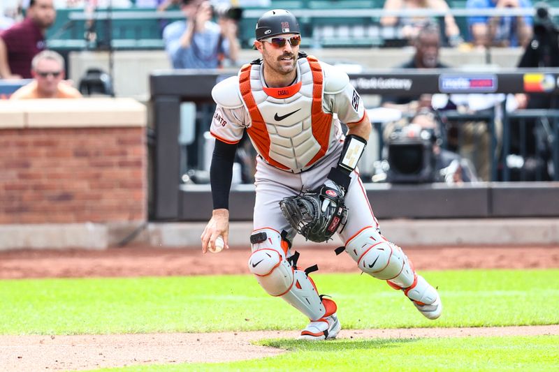 May 25, 2024; New York City, New York, USA;  San Francisco Giants catcher Curt Casali (18) looks a runner back in the eighth inning against the New York Mets at Citi Field. Mandatory Credit: Wendell Cruz-USA TODAY Sports