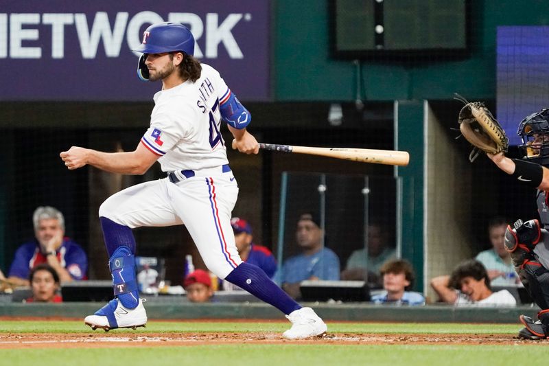 Jun 29, 2023; Arlington, Texas, USA; Texas Rangers shortstop Josh Smith (47) follows thru on a single, that hit off the leg of Detroit Tigers starting pitcher Reese Olson (not pictured) during the second inning at Globe Life Field. Mandatory Credit: Raymond Carlin III-USA TODAY Sports