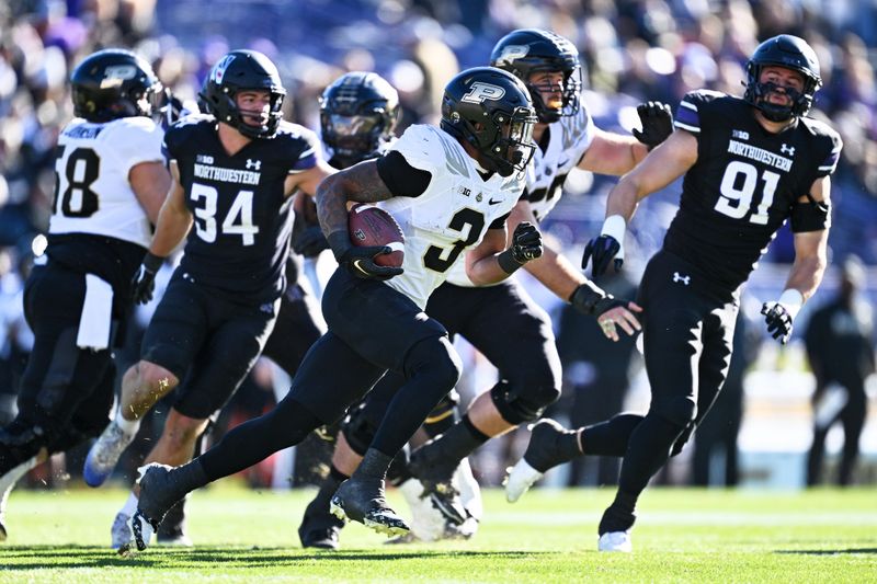 Nov 18, 2023; Evanston, Illinois, USA;  Purdue Boilermakers running back Tyrone Tracy Jr. (3) runs the ball in the first quarter against the Northwestern Wildcats at Ryan Field. Mandatory Credit: Jamie Sabau-USA TODAY Sports