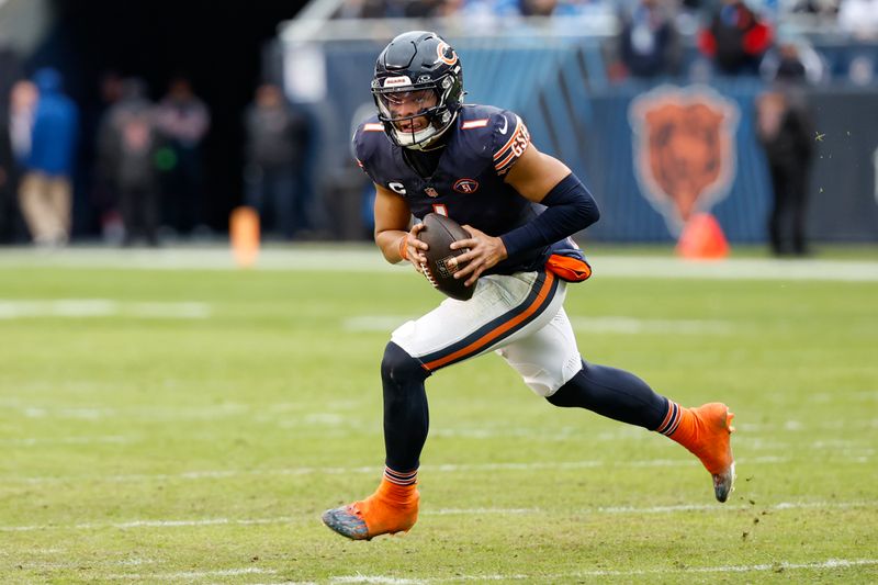 Chicago Bears quarterback Justin Fields (1) runs with the ball to score a touchdown against the Detroit Lions during the second half of an NFL football game, Sunday, Dec. 10, 2023, in Chicago. (AP Photo/Kamil Krzaczynski)