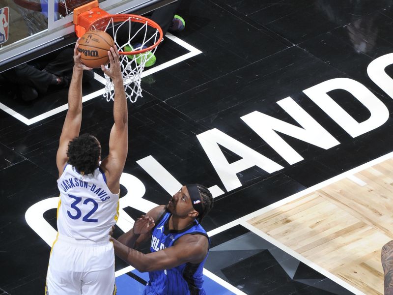 ORLANDO, FL - MARCH 27: Trayce Jackson-Davis #32 of the Golden State Warriors  drives to the basket during the game against the Orlando Magic on March 27, 2024 at Amway Center in Orlando, Florida. NOTE TO USER: User expressly acknowledges and agrees that, by downloading and or using this photograph, User is consenting to the terms and conditions of the Getty Images License Agreement. Mandatory Copyright Notice: Copyright 2024 NBAE (Photo by Fernando Medina/NBAE via Getty Images)