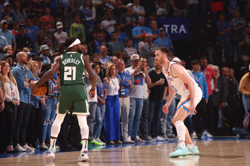 OKLAHOMA CITY, OK - APRIL 12: Patrick Beverley #21 of the Milwaukee Bucks handles the ball during the game against the Oklahoma City Thunder on April 12, 2024 at Paycom Arena in Oklahoma City, Oklahoma. NOTE TO USER: User expressly acknowledges and agrees that, by downloading and or using this photograph, User is consenting to the terms and conditions of the Getty Images License Agreement. Mandatory Copyright Notice: Copyright 2024 NBAE (Photo by Zach Beeker/NBAE via Getty Images)