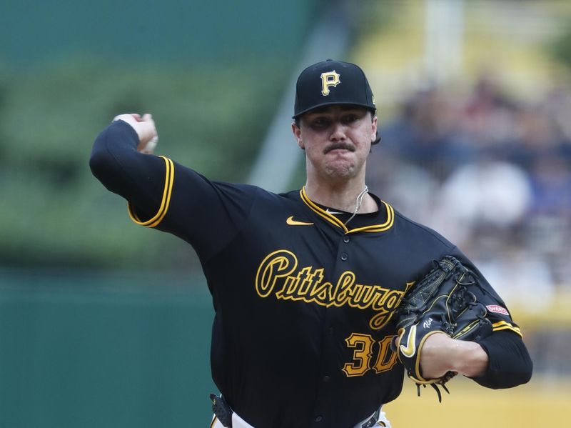 Jul 23, 2024; Pittsburgh, Pennsylvania, USA;  Pittsburgh Pirates starting pitcher Paul Skenes (30) delivers a pitch against the St. Louis Cardinals during the first inning at PNC Park. Mandatory Credit: Charles LeClaire-USA TODAY Sports