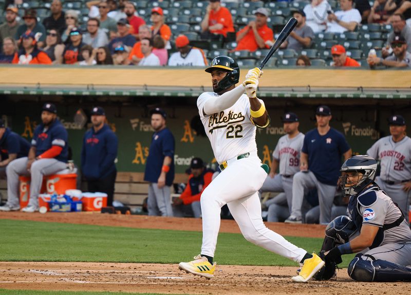 Jul 22, 2024; Oakland, California, USA; Oakland Athletics left fielder Miguel Andujar (22) hits a two-run RBI double against the Houston Astros during the third inning at Oakland-Alameda County Coliseum. Mandatory Credit: Kelley L Cox-USA TODAY Sports