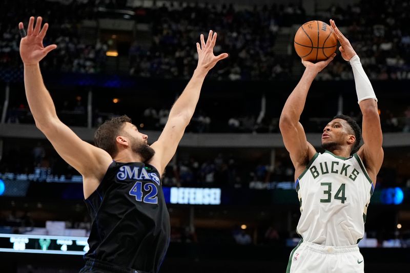 DALLAS, TEXAS - FEBRUARY 03: Giannis Antetokounmpo #34 of the Milwaukee Bucks shoots as Maxi Kleber #42 of the Dallas Mavericks defends during the second half at American Airlines Center on February 03, 2024 in Dallas, Texas. NOTE TO USER: User expressly acknowledges and agrees that, by downloading and or using this photograph, User is consenting to the terms and conditions of the Getty Images License Agreement. (Photo by Sam Hodde/Getty Images)