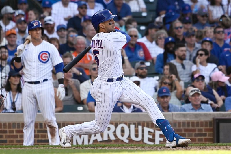 Sep 23, 2023; Chicago, Illinois, USA; Chicago Cubs second baseman Christopher Morel (5) watches his home run against the Colorado Rockies during the eighth inning at Wrigley Field. Mandatory Credit: Matt Marton-USA TODAY Sports