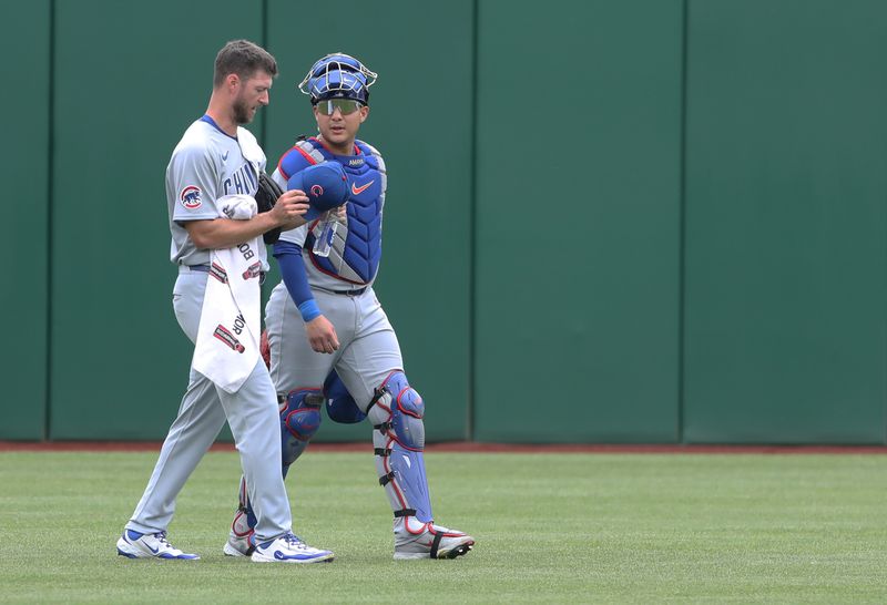May 1, 2025; Pittsburgh, Pennsylvania, USA;  Chicago Cubs starting pitcher Colin Rea (left) and catcher Miguel Amaya (9) make their way n from the bullpen to play the Pittsburgh Pirates at PNC Park. Mandatory Credit: Charles LeClaire-Imagn Images