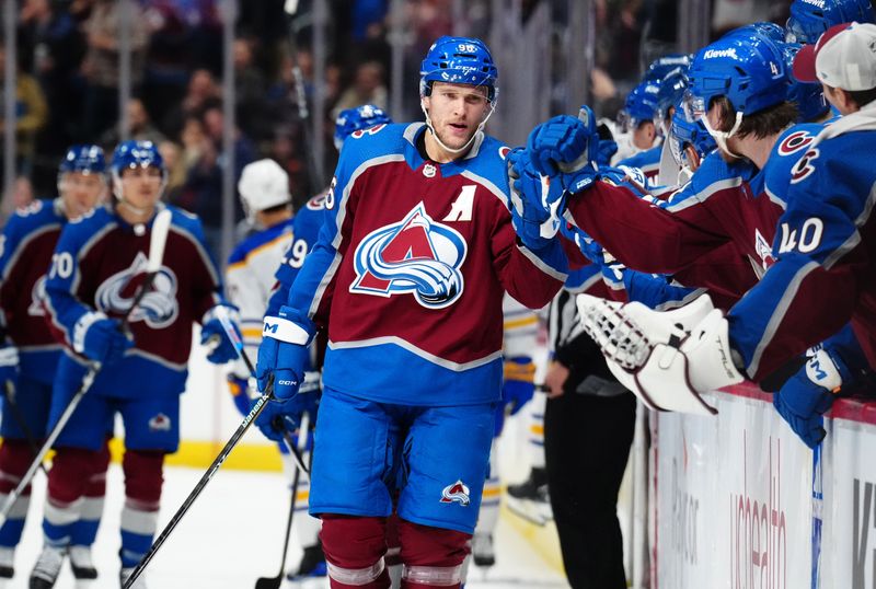 Dec 13, 2023; Denver, Colorado, USA; Colorado Avalanche right wing Mikko Rantanen (96) celebrates his goal in the first period against the Buffalo Sabres at Ball Arena. Mandatory Credit: Ron Chenoy-USA TODAY Sports