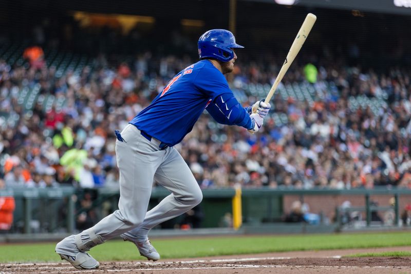 Jun 25, 2024; San Francisco, California, USA; Chicago Cubs right fielder Cody Bellinger (24) hits a single against the San Francisco Giants during the third inning at Oracle Park. Mandatory Credit: John Hefti-USA TODAY Sports